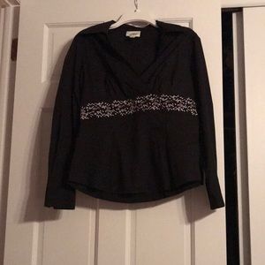 Black collared shirt with white detailing at waist